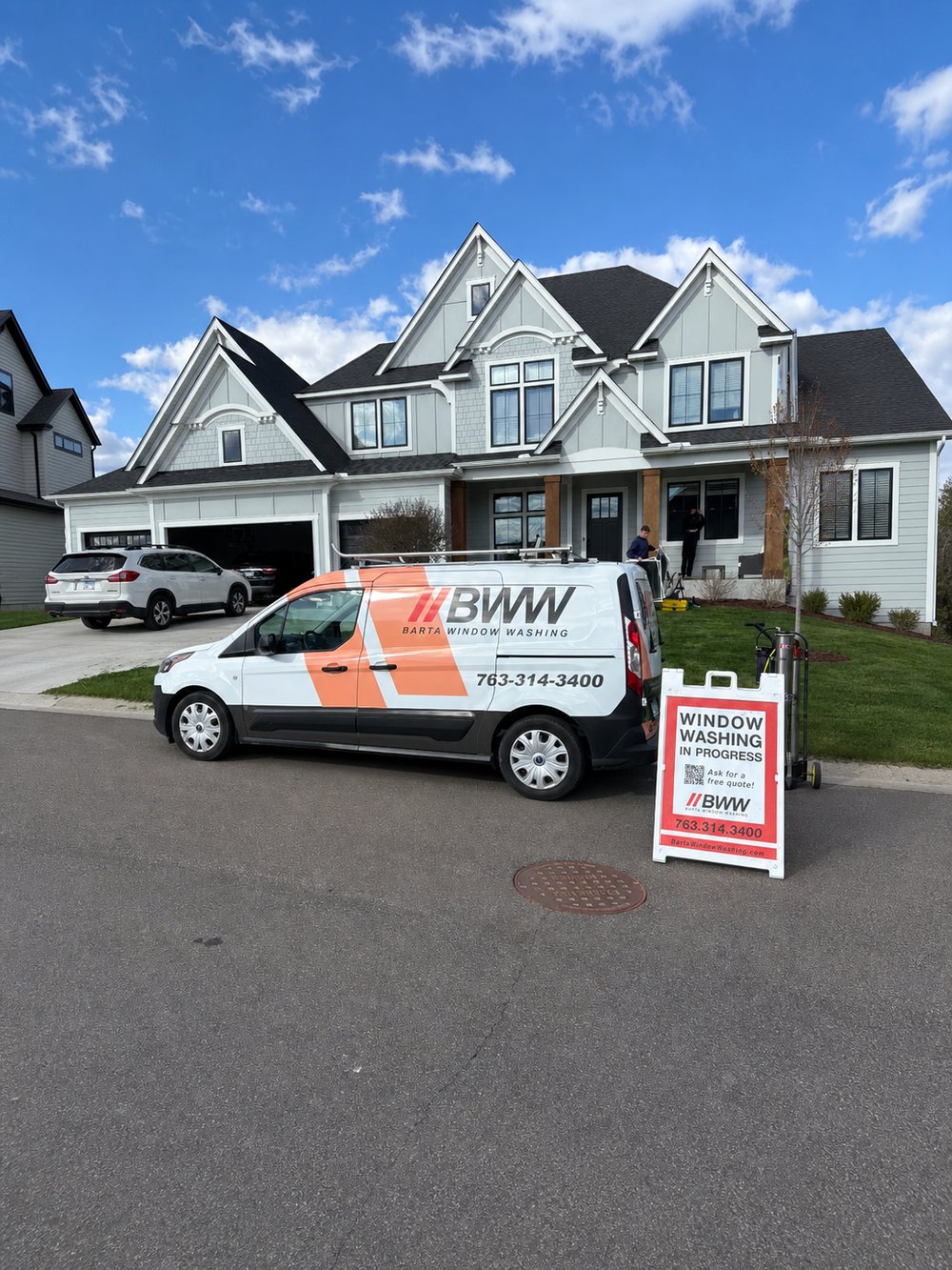 A fully branded Barta Window Washing service van